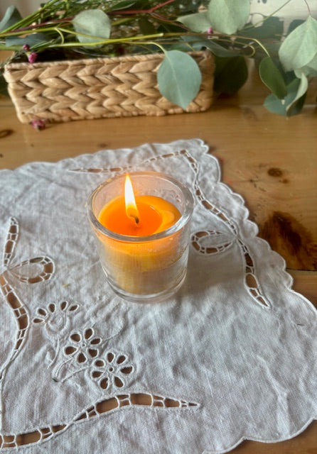 a container candle burning